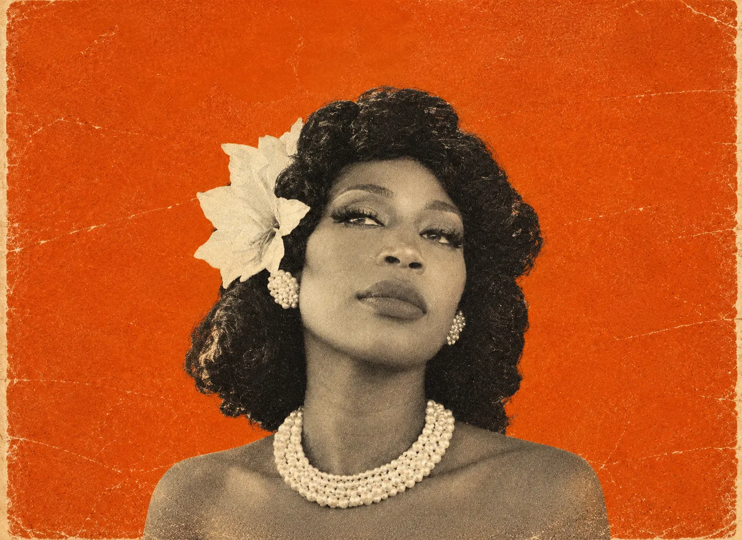 Raquel Nicole Jeté in pearls with a white flower in her hair